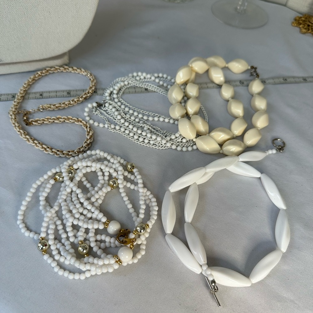 Five beige and white vintage to modern necklaces